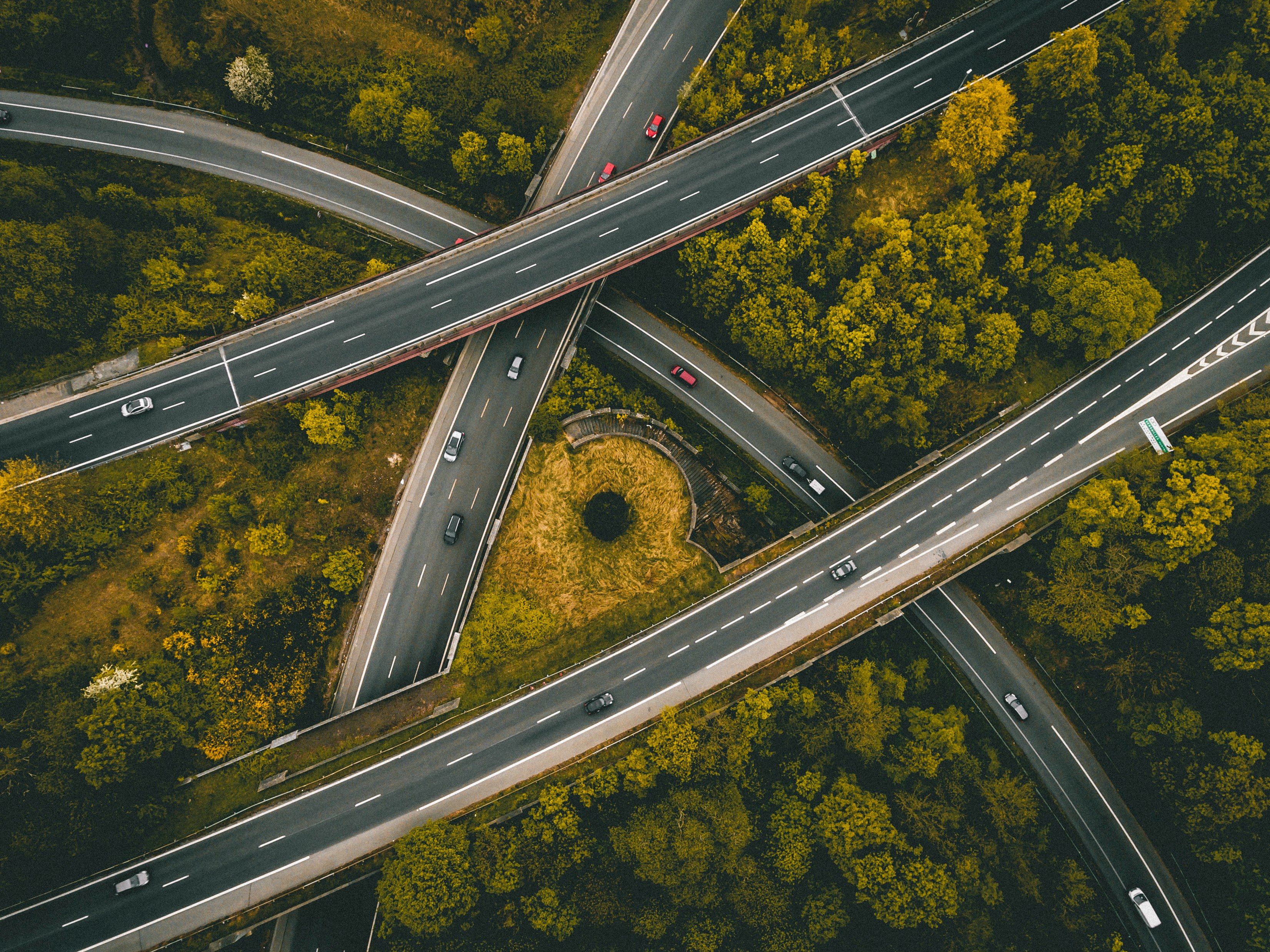 aerial photography of interlocking freeways with travelling cars